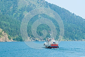 The waterbus with turists sails on lake Baikal. photo