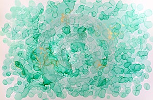 Watercolor abstract texture. Green and gold drops illustration.