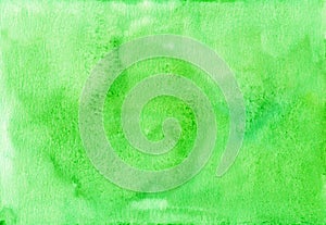 Watercolor bright green background texture. Aquarelle greenery color trend backdrop. Stains on paper