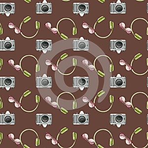 Watercolor fashion seamless pattern with trip accessories. Photo camera,sunglasses,headphones on brown background.