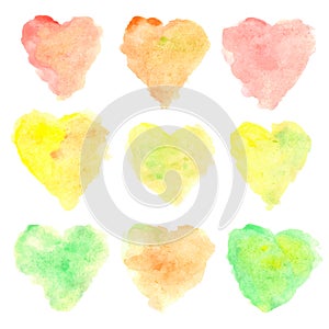 Watercolor heart shaped stains isolated on white background. Set of colorful hand painted spots. Autumn tints. Vector