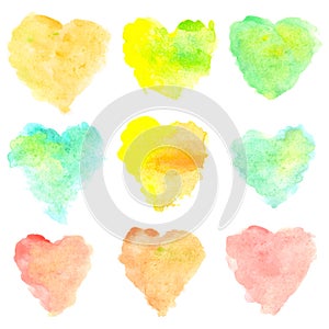 Watercolor heart shaped stains isolated on white background. Set of red, yellow, blue, green, orange hand painted spots