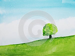Watercolor landscape hill and tree stand alone in green meadow field with blue sky.hand drawn on paper.