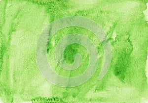 Watercolor light green background texture. Aquarelle kelly green color backdrop. Stains on paper
