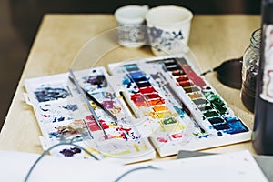 Watercolor paint palette and brushes