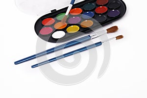 Watercolor paint palette and brushes