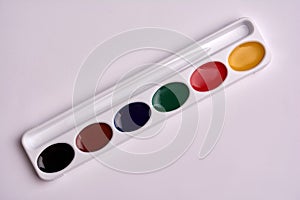 Watercolor paint palette on a white background