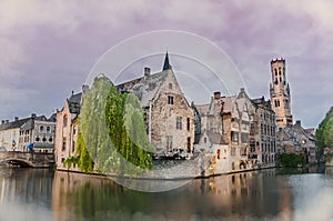 Watercolor painting effect of photo with view on Bruges old town and Belfry tower with pink sky during twilight, Bruges, Belgium.