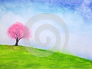 Watercolor landscape hill and cherry blossom or sakura tree stand alone in green meadow field with blue sky.hand drawn on paper.