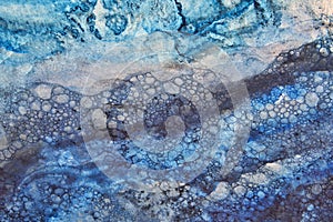 Watercolor painting of water flowing over pebbles