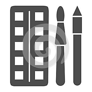 Watercolor paints with brush and pencil solid icon, stationery concept, painting tools sign on white background, paint