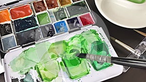 Watercolor paints mixing and color selection