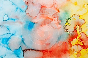 Watercolor paper sheet painted with primary colors