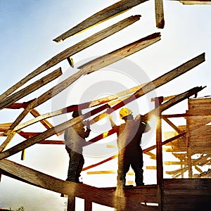 Watercolor of roofer working on roof structure at construction site