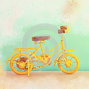 Watercolor style and abstract illustration of retro yellow bicycle.