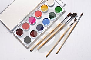Watercolors and brushes