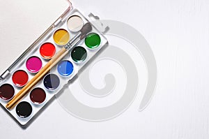 Watercolors and brushes