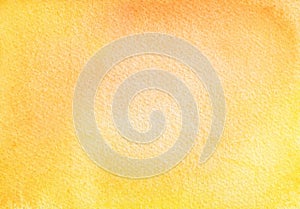 Watercolour background of bright yellow ang orange colors with soft gradient and grainy paper texture.