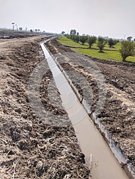 Watercourse lined-watercourse irrigation- watercourse irrigation-course drain open watercourses agriculture land photo photo