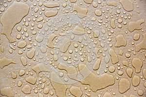 waterdrop on brown surface. droplet on mirror. image for background, wallpaper and copy space.