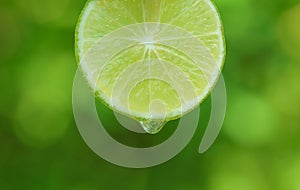 Waterdrop falling on limes