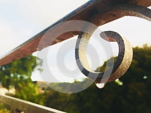 Waterdrop hang on steel rusty railing