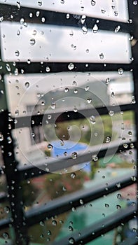 Waterdrop at window glass inside building