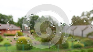 Waterdrops on the glass of window on raining day