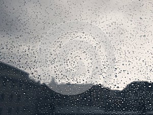 Waterdrops over the window after summer rain in the city