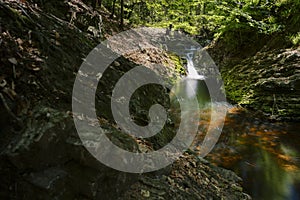 Waterfal Leopold II or Cascade with mountain river along hiking trail