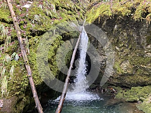 Waterfall at Aberenbach stream or Aberenbachfall waterfall Aberenbachfall Wasserfall near alpine Lake WÃ¤gitalersee