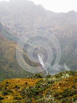 Waterfall on the Andes mountains in mist.