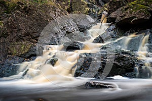 Waterfall during autumn in Danska Fall nature reserve close to Halmstad on the Swedish west coast.