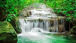 Waterfall in autumn forest at Erawan waterfall