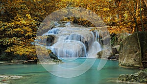 Waterfall in autumn forest at Erawan waterfall