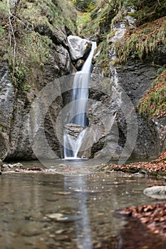 Waterfall with autumn leaves in the spanish Pirinees