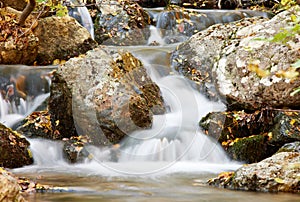 Waterfall on autumn tream