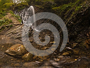 Waterfall in the autumn woods