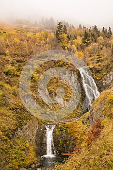 Waterfall in the autumnal Pyrenees mountains photo