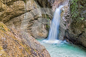 Waterfall with bare rocks in Almbach gorge near Berchtesgaden, Germany