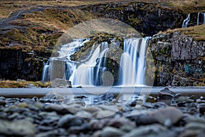 Waterfall and beautiful view at the kirkjufell mountain in iceland europe