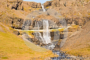 Waterfall Bergarfoss in Hornafjordur in south Icelandic countryside