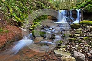 Waterfall blurred on the river Ennig; at the Pwll y Wrach nature reserve