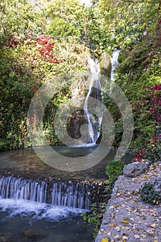 A waterfall in a botanical garden in the city of Balchik