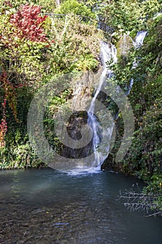 A waterfall in a botanical garden in the city of Balchik