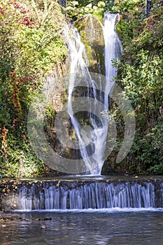 A waterfall in a botanical garden in the city of Balchik