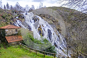 Waterfall of BraÃÂ±as in the municipality of Toques Galicia, Spain photo