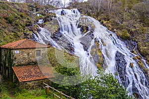 Waterfall of BraÃÂ±as in the municipality of Toques Galicia, Spain photo