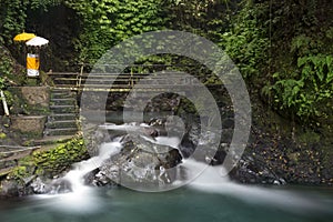 Waterfall and bridge at Gitgit waterfall.