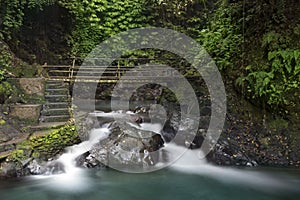 Waterfall and bridge at Gitgit waterfall.